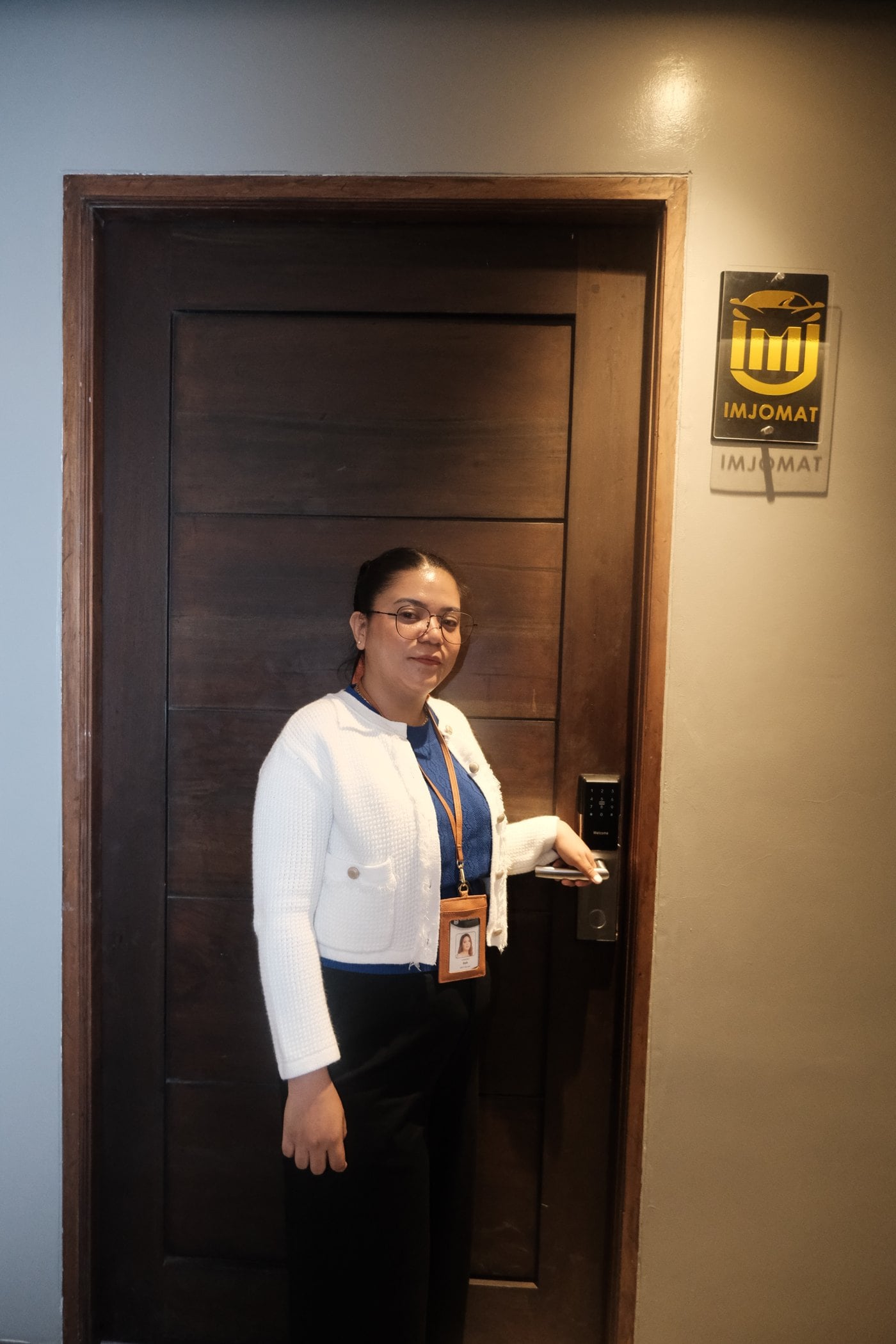 Sarah Garcia, founder of Imjomat, clocking in at the office door on the in-house device she built on Hercules